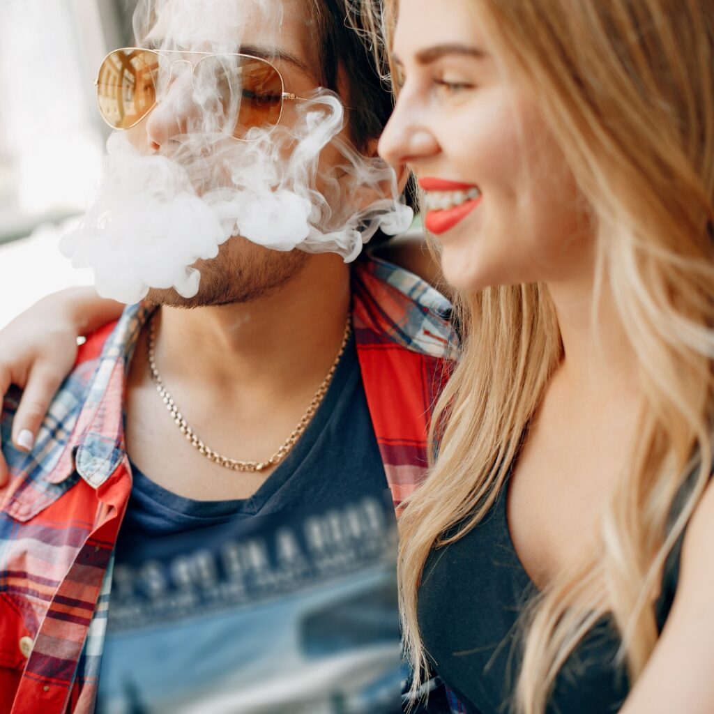 image of two people vaping