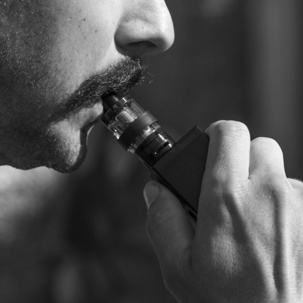 man using a vape